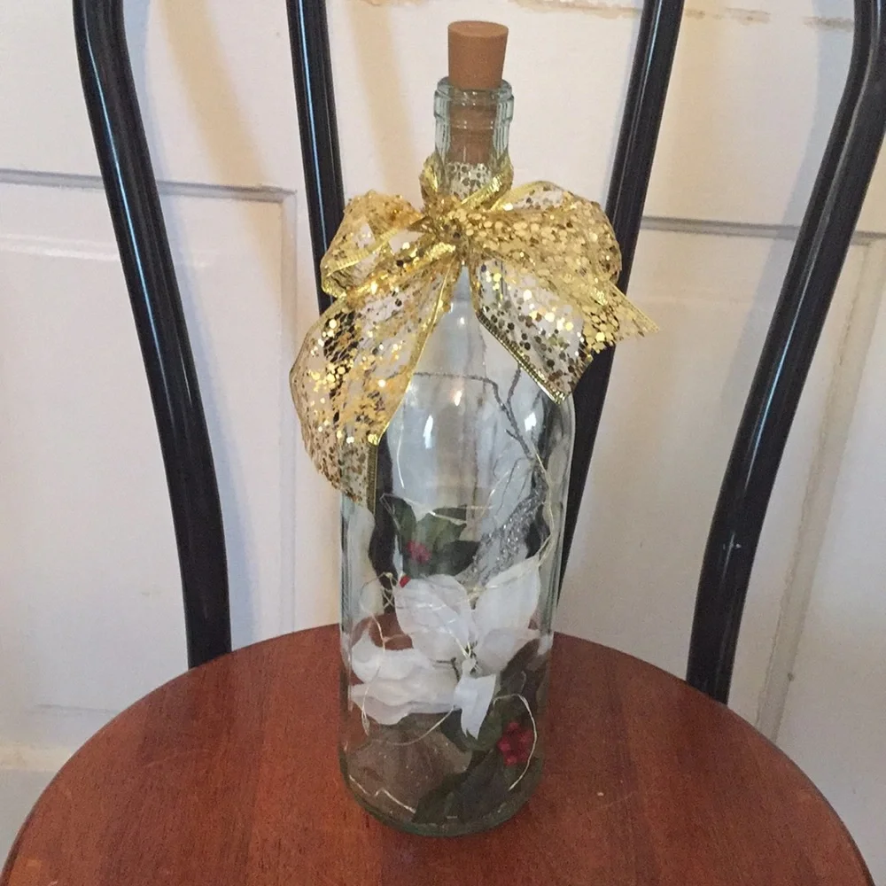 White poinsettia wine bottle lantern